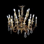 A Continental gilt-bronze and cut glass twenty-four light chandelier in Rococo taste