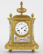 A French Sevres style porcelain and gilt metal mantel clock