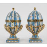 A pair of 20th century continental porcelain and gilt metal mounted ovoid caskets