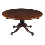 A large circular mahogany breakfast table in the mid-18th century style