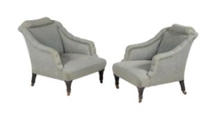 A pair of Victorian ebonised and upholstered low armchairs