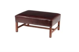 A leather upholstered centre stool