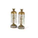 A pair of gilt metal, marble mounted and glass hung lustre candlesticks