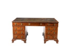 A figured walnut partner's pedestal desk