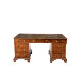 A figured walnut partner's pedestal desk