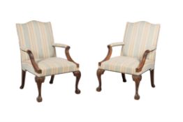 A pair of mahogany and upholstered armchairs