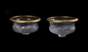 A pair of modern French moulded and clear cut glass and gilt metal mounted centre bowls