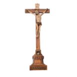 A Continental polychrome painted Crucifix