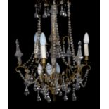 A moulded glass and gilt metal mounted seven light chandelier in George III style