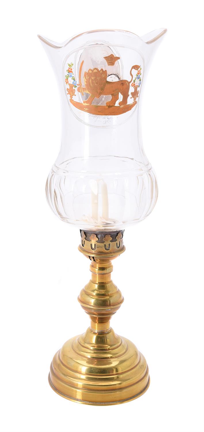 A moulded glass and brass mounted storm lantern with a medallion of Mozzaffar ad-Din Shah Qajar