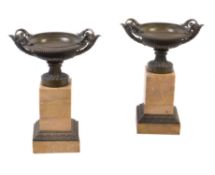 A pair of Louis Philippe patinated bronze and Siena marble mounted tazza urns on plinths