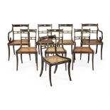 A Set of eight Regency ebonised and parcel gilt dining chairs