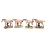 A group of similar Staffordshire pottery models of four dun horses of William Kent Ltd. type