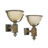 A pair of gilt and brushed metal and frosted glass wall lights