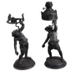 A companion pair of patinated bronze models of Silenus after the Antique
