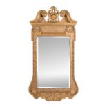 A giltwood wall mirror in George II style