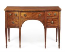 A George III mahogany serpentine fronted sideboard