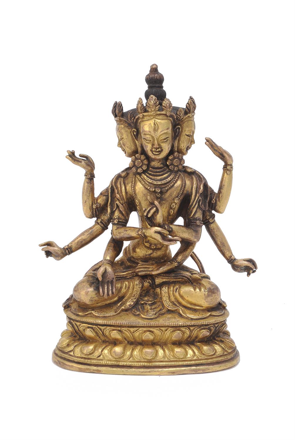 A Sino-Tibetan gilt-bronze eight-armed goddess