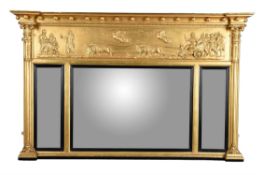 An early Victorian giltwood and composition overmantel wall mirror