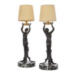A pair of patinated bronze and marble mounted figural table lamps