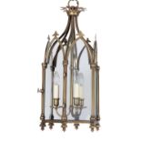 A pair of brass and glazed hall lanterns in Gothic style