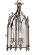 A pair of brass and glazed hall lanterns in Gothic style