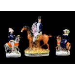 A group of three Staffordshire equestrian figures