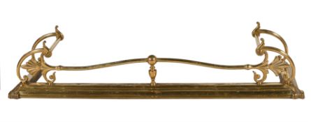 A gilt brass fender in Regency style