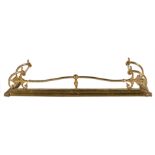 A gilt brass fender in Regency style