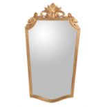 A giltwood wall mirror in late 18th century style