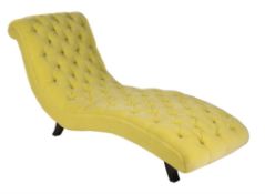 An ebonised and button upholstered chaise longue