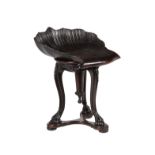 A mahogany shell shaped stool