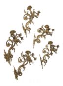 A set of five French gilt bronze five light wall appliques