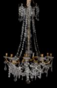 A moulded glass and gilt metal mounted eight branch chandelier