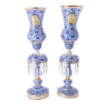 A pair of Beykoz glass storm lanterns with medallions of Mozzaffar ad-Din Shah Qajar