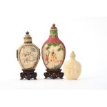 Y Two Chinese stained ivory snuff bottles