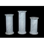 A graduated set of three simulated marble plinths