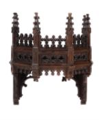 A Gothic Revival carved oak canopy