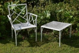 A white painted metal garden armchair in Chinese Chippendale style