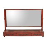A red lacquered dressing mirror