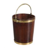 A George III mahogany and brass bound peat bucket