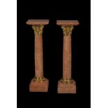 A pair of fine pink Breccia marble and gilt metal mounted columnar pedestals