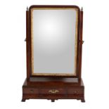 A George III mahogany and parcel gilt dressing mirror