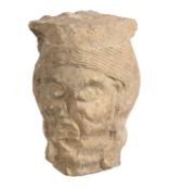 A sculpted limestone head of a man