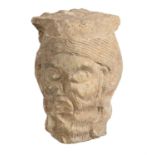 A sculpted limestone head of a man