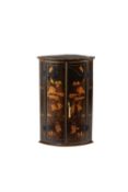 A George II black lacquer and gilt corner cabinet