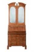 A George I walnut and featherbanded bureau bookcase