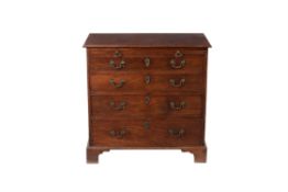 A George III mahogany and 'plum pudding' mahogany bachelor's chest of drawers