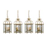 A set of four gilt metal and glazed hexagonal hall lanterns