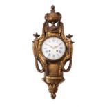 A French gilt metal cartel wall clock in Louis XVI style